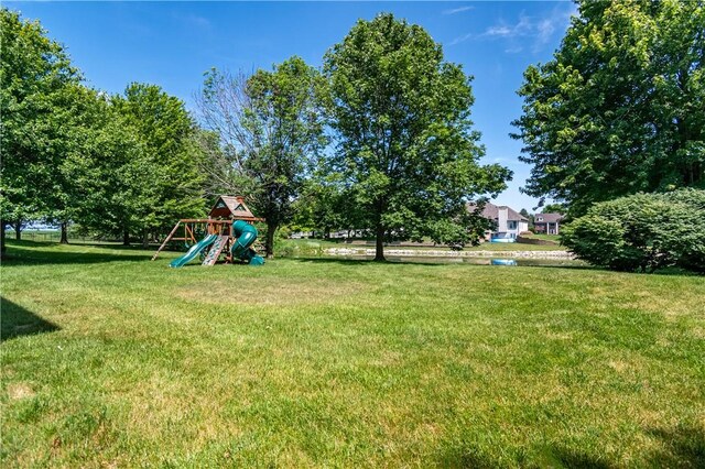 1250 W Hickory Point Rd, Decatur, IL 62526 - view of grassy yard with a playground