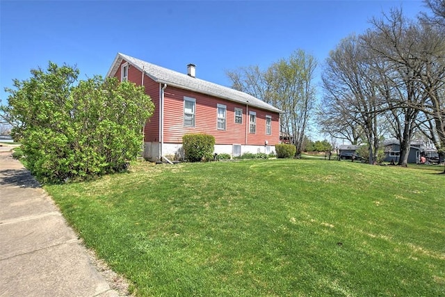 view of home's exterior featuring a yard