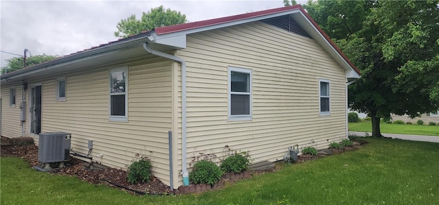22 S Lakewood Dr, Effingham, IL 62401 - view of home's exterior with central air condition unit and a lawn