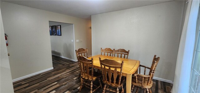 22 S Lakewood Dr, Effingham, IL 62401 - dining room with dark wood-style flooring and baseboards