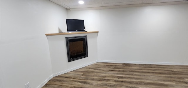 22 S Lakewood Dr, Effingham, IL 62401 - finished basement with a fireplace, wood finished floors, baseboards, and a drop ceiling