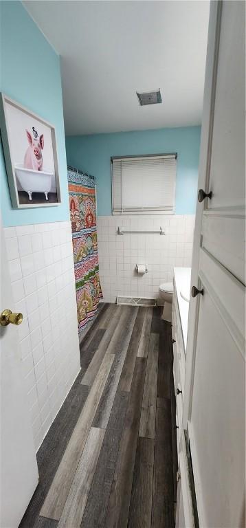 22 S Lakewood Dr, Effingham, IL 62401 - full bath with tile walls, a wainscoted wall, vanity, toilet, and wood finished floors