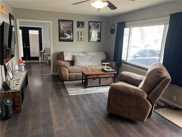 201 Franklin St, Pana, IL 62557 - living room with baseboards, dark wood-style flooring, and ceiling fan