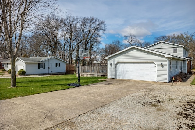 view of home's exterior featuring a yard and a garage