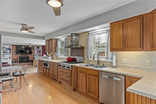 dining area featuring ceiling fan with notable chandelier and light wood-type flooring