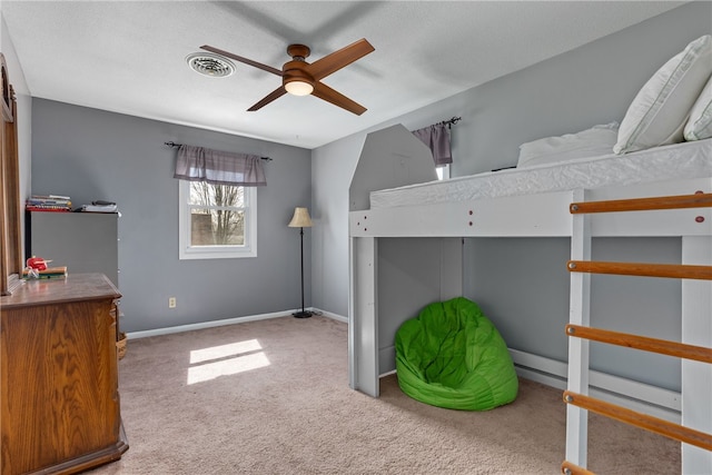 unfurnished bedroom with a textured ceiling, carpet floors, and ceiling fan