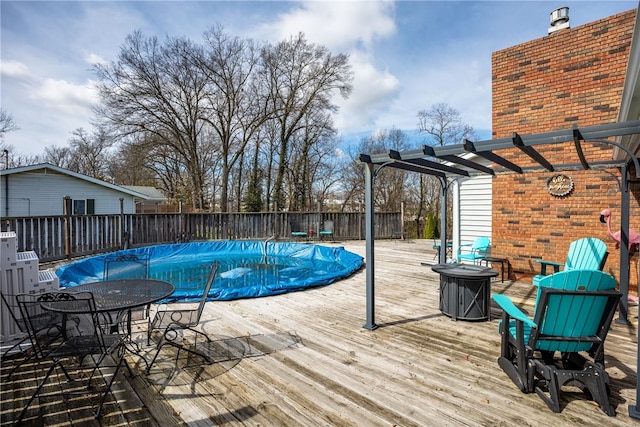 view of swimming pool with a wooden deck