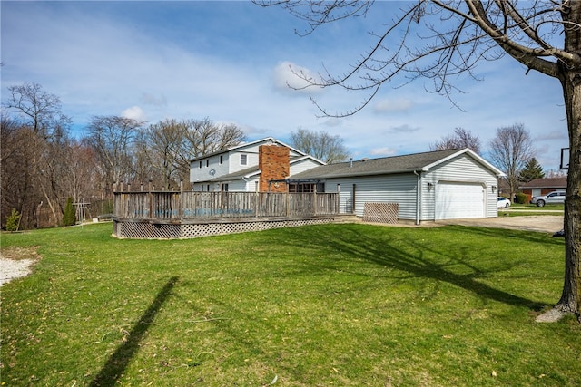 exterior space featuring a wooden deck, a front yard, and a garage