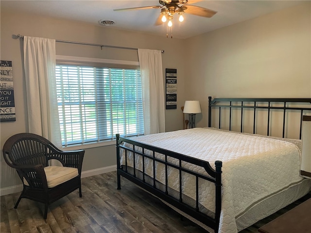 104 Woodland Dr, Marshall, IL 62441 - bedroom with ceiling fan, dark hardwood / wood-style flooring, and multiple windows