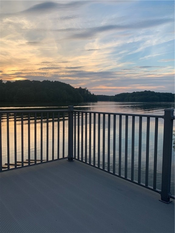 104 Woodland Dr, Marshall, IL 62441 - balcony at dusk with a water view