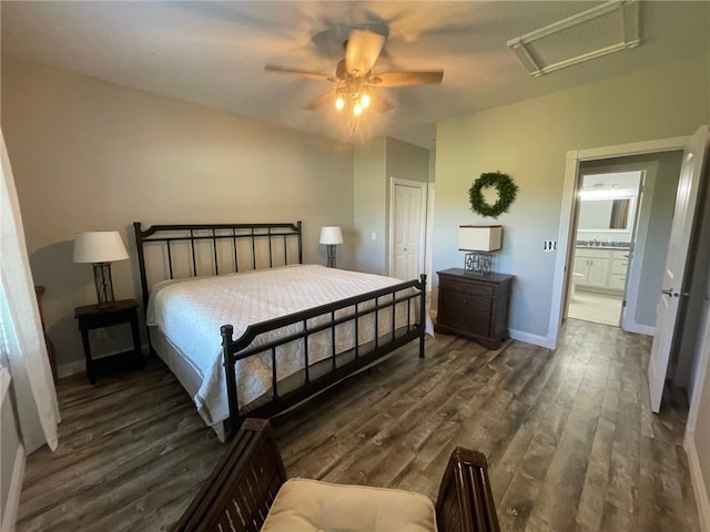 104 Woodland Dr, Marshall, IL 62441 - bedroom with a closet, ensuite bath, ceiling fan, and dark hardwood / wood-style floors