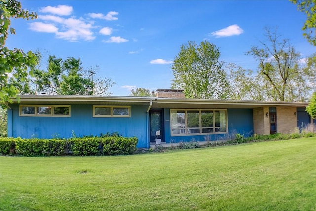 27 Heather Dr, Charleston, IL 61920 - view of front facade with a front lawn and a chimney