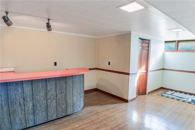 27 Heather Dr, Charleston, IL 61920 - bar with wood finished floors, crown molding, and baseboards