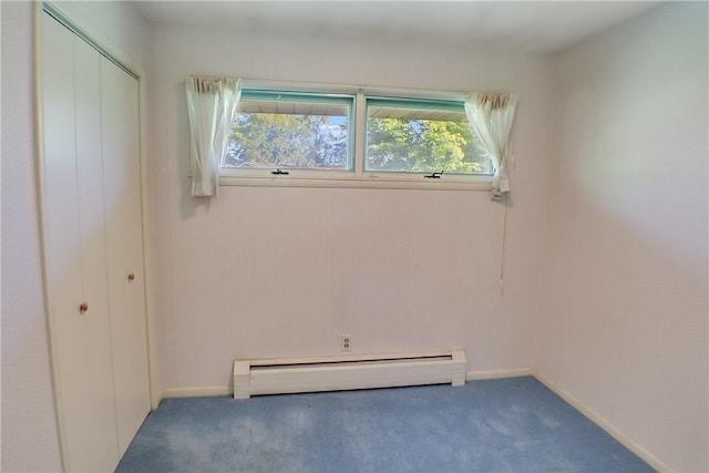 27 Heather Dr, Charleston, IL 61920 - unfurnished bedroom featuring a baseboard radiator, carpet flooring, and a closet