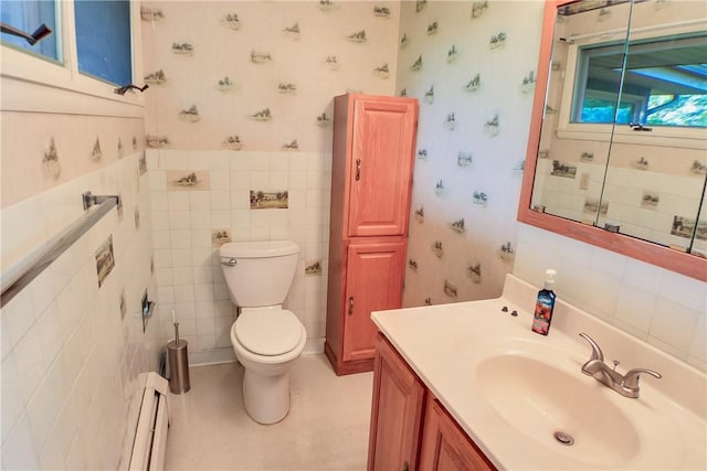 27 Heather Dr, Charleston, IL 61920 - bathroom featuring a baseboard radiator, wallpapered walls, vanity, toilet, and tile walls