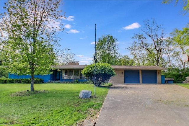 27 Heather Dr, Charleston, IL 61920 - view of front of house featuring a front lawn, a garage, driveway, and a chimney