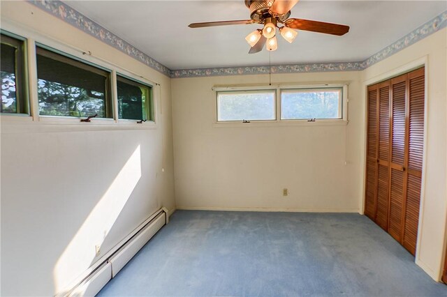 27 Heather Dr, Charleston, IL 61920 - unfurnished bedroom featuring carpet floors, a closet, baseboard heating, and baseboards