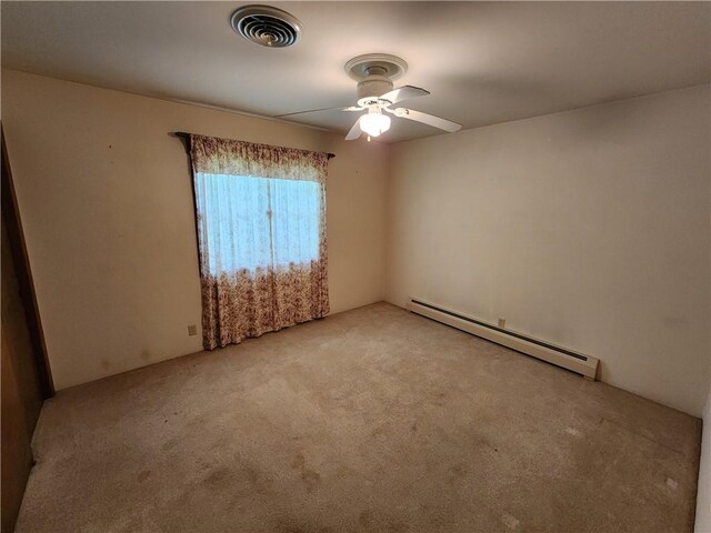 2638 E 1050th Ave, Oblong, IL 62449 - empty room featuring baseboard heating, light carpet, and a ceiling fan