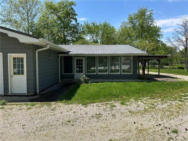 2638 E 1050th Ave, Oblong, IL 62449 - rear view of house featuring a yard and metal roof