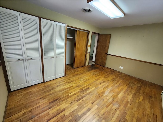 2638 E 1050th Ave, Oblong, IL 62449 - unfurnished bedroom featuring light wood finished floors