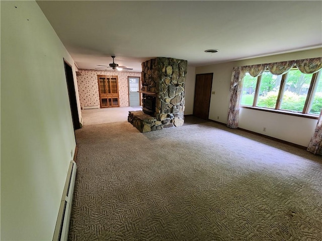 2638 E 1050th Ave, Oblong, IL 62449 - carpeted living room with a baseboard radiator, baseboard heating, ceiling fan, and baseboards