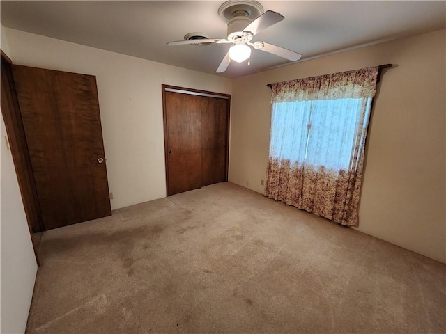 2638 E 1050th Ave, Oblong, IL 62449 - unfurnished bedroom featuring light carpet, a closet, and ceiling fan