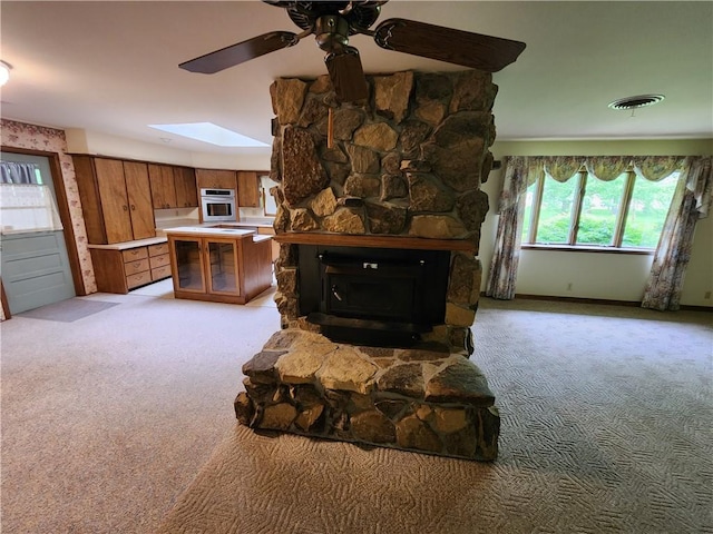 2638 E 1050th Ave, Oblong, IL 62449 - living room featuring light colored carpet, a skylight, and ceiling fan