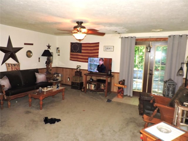 20643 1200 N Rd, Danville, IL 61834 - living area featuring a wainscoted wall, carpet flooring, a ceiling fan, a textured ceiling, and wood walls