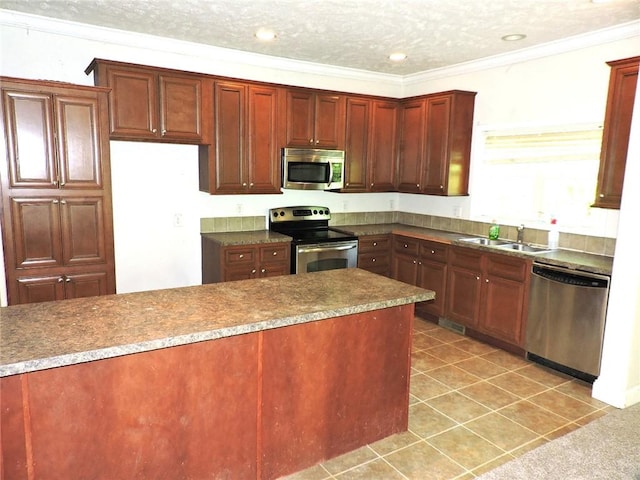 20643 1200 N Rd, Danville, IL 61834 - kitchen with stainless steel appliances, a sink, light tile patterned floors, recessed lighting, and crown molding