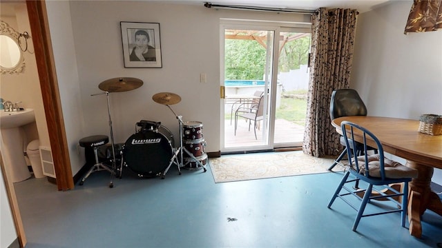 dining space featuring concrete floors