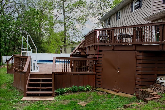 exterior space with stairway, fence, and a fenced in pool