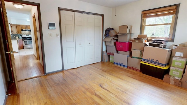 bedroom featuring a closet and light wood-type flooring
