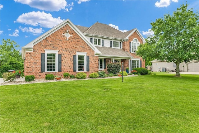 715 W Coolidge Ave, Charleston, IL 61920 - view of front of house featuring brick siding and a front yard