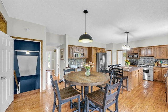 715 W Coolidge Ave, Charleston, IL 61920 - dining space featuring light wood-type flooring