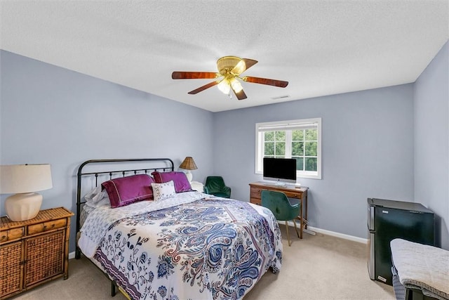 715 W Coolidge Ave, Charleston, IL 61920 - bedroom with light carpet and ceiling fan