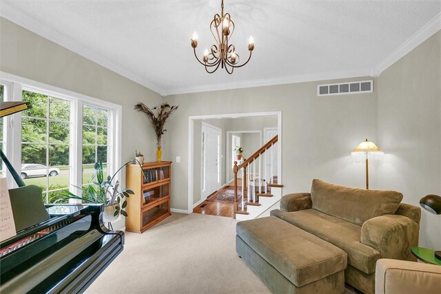 715 W Coolidge Ave, Charleston, IL 61920 - living area featuring crown molding, a chandelier, and light carpet