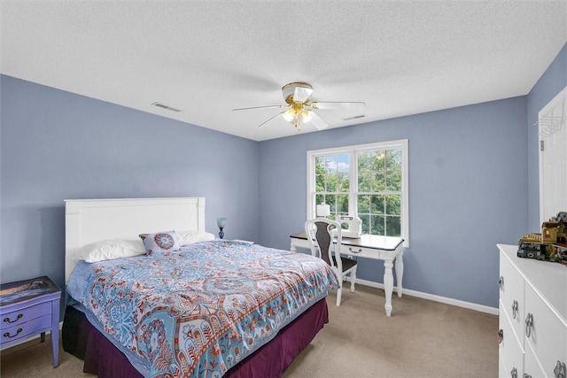715 W Coolidge Ave, Charleston, IL 61920 - bedroom with light colored carpet, a ceiling fan, and a textured ceiling