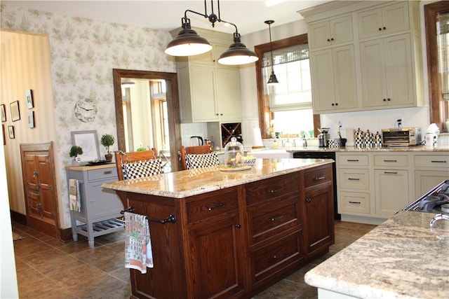 300 W N 1st St, Shelbyville, IL 62565 - kitchen featuring wallpapered walls, light stone counters, a center island, hanging light fixtures, and dark tile patterned flooring