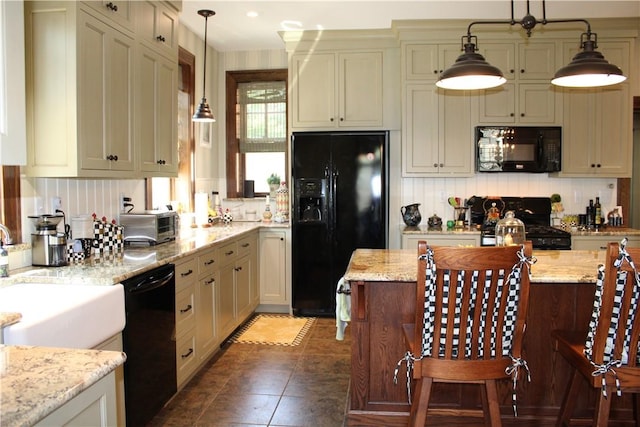 300 W N 1st St, Shelbyville, IL 62565 - kitchen with black appliances, hanging light fixtures, backsplash, and light stone countertops