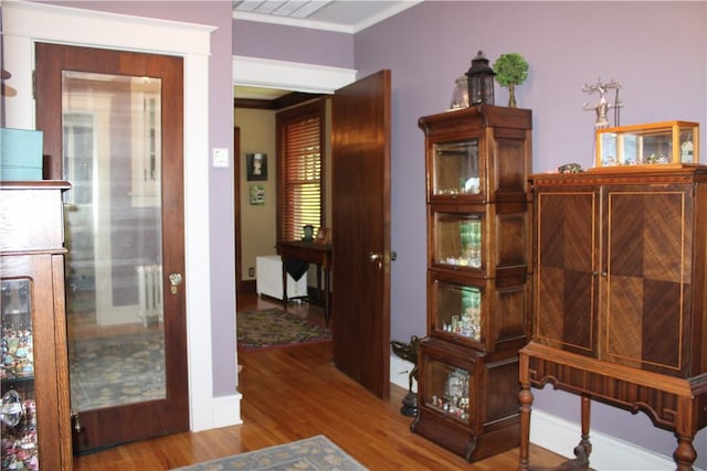 300 W N 1st St, Shelbyville, IL 62565 - hall featuring crown molding, wood finished floors, radiator, and baseboards