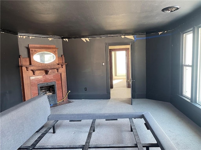 living room with carpet floors and a healthy amount of sunlight