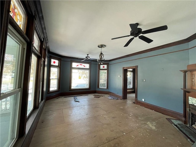 interior space featuring ceiling fan and crown molding