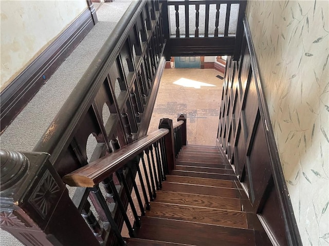 stairway with hardwood / wood-style floors