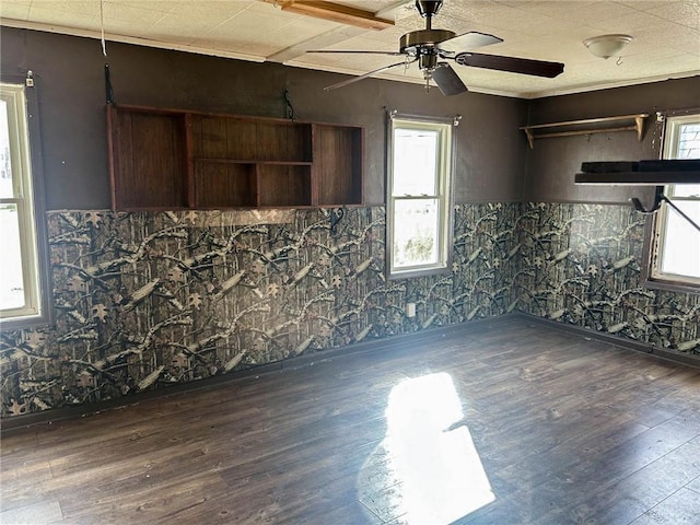 unfurnished living room with wood finished floors and a ceiling fan