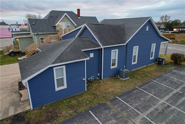 rear view of property featuring cooling unit