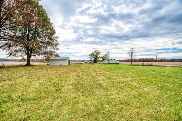 18004 N 2180th St, Marshall, IL 62441 - view of grassy yard featuring a view of countryside and a storage unit