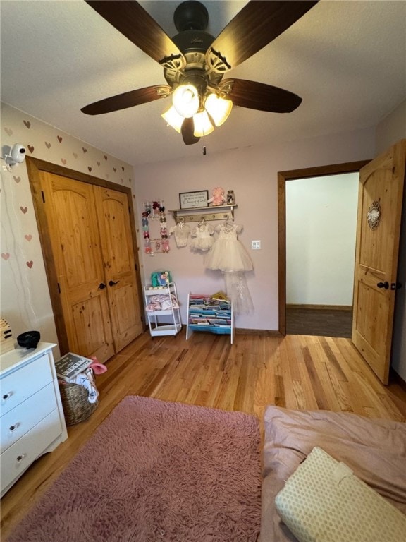 6414 300th Rd, Martinsville, IL 62442 - living room featuring light wood-type flooring, ceiling fan, and baseboards