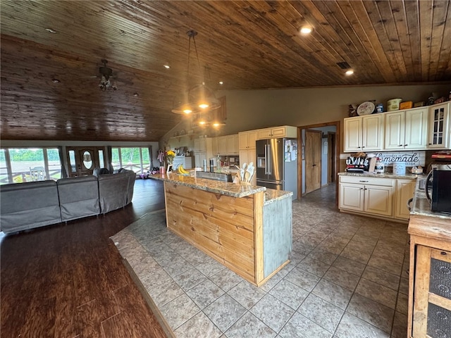 6414 300th Rd, Martinsville, IL 62442 - kitchen with stainless steel fridge with ice dispenser, wood ceiling, open floor plan, black microwave, and light stone counters