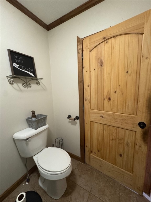 6414 300th Rd, Martinsville, IL 62442 - bathroom with ornamental molding, toilet, baseboards, and tile patterned flooring
