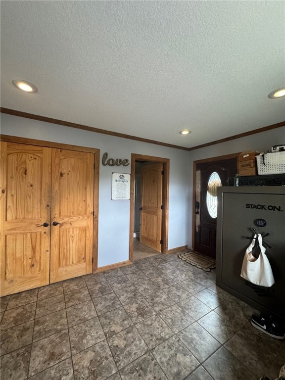 6414 300th Rd, Martinsville, IL 62442 - entryway with crown molding, a textured ceiling, baseboards, and recessed lighting